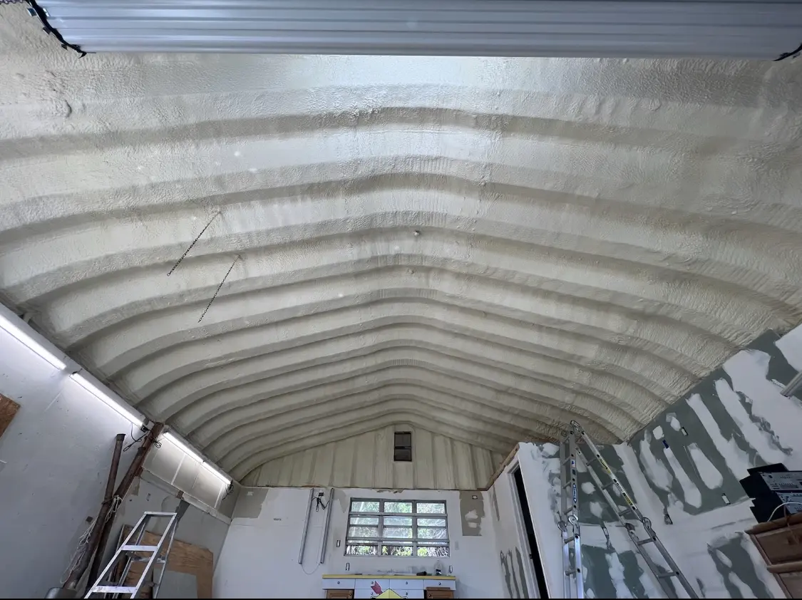 Spray polyurethane foam applied to the underside of a metal roof deck in Creswell